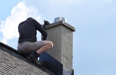 Man Adjusting Roofing Flashing