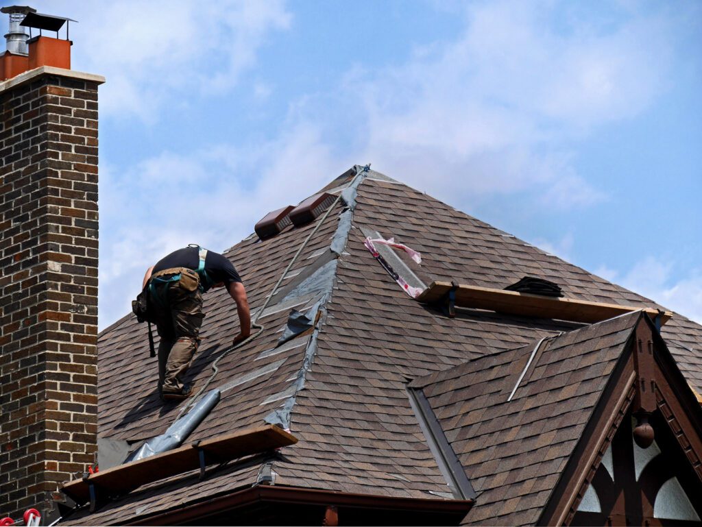 Man repairing roof