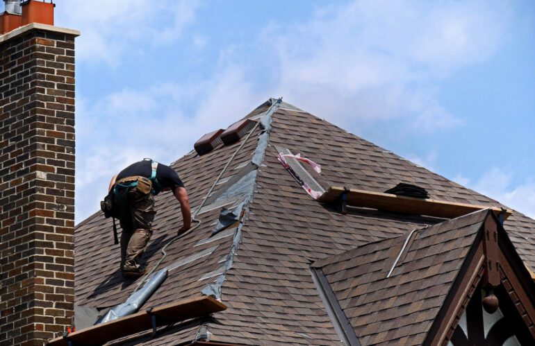 Man repairing roof
