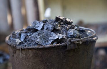a bucket of tar on the fire, for roof repairs